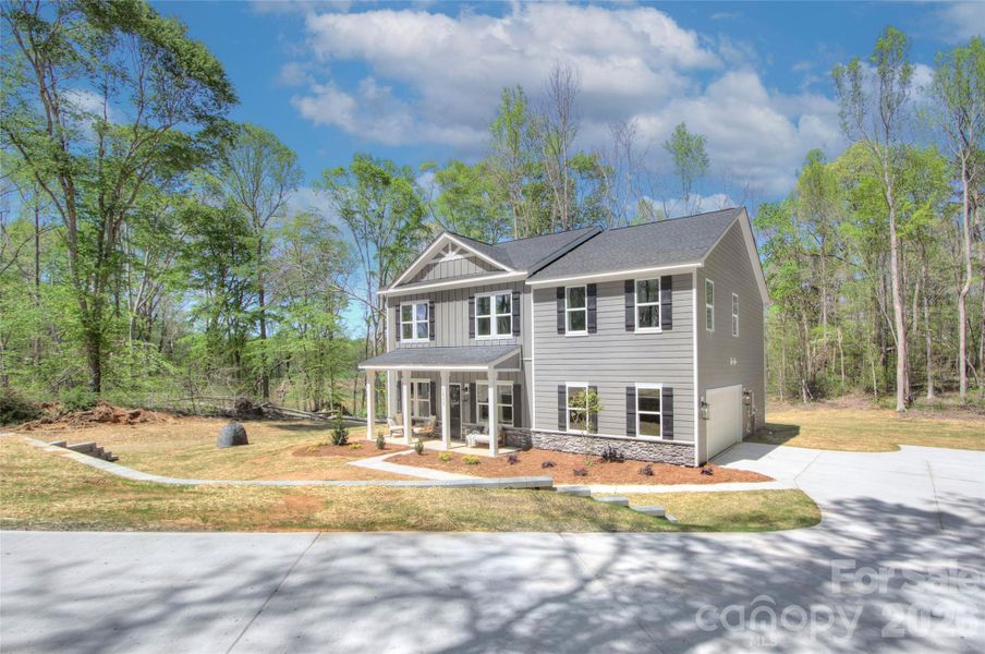 Front exterior of a new home in , Bessemer City, NC, highlighting curb appeal (Image 1). Front exterior of a new home in , Bessemer City, NC, highlighting curb appeal (Image 1).