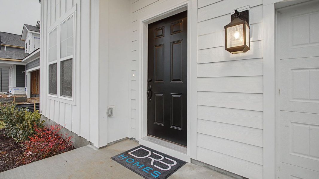 Exterior details and patio area of a home in Cottages of Bearwood, Mount Pleasant (Image 3).