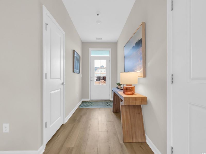 Entryway with wood finished floors and baseboards Entryway with wood finished floors and baseboards