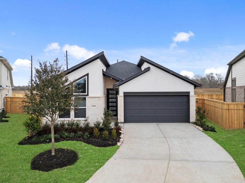 Front exterior of a new home in Sienna 45', 50', Missouri City, TX, highlighting curb appeal (Image 22).