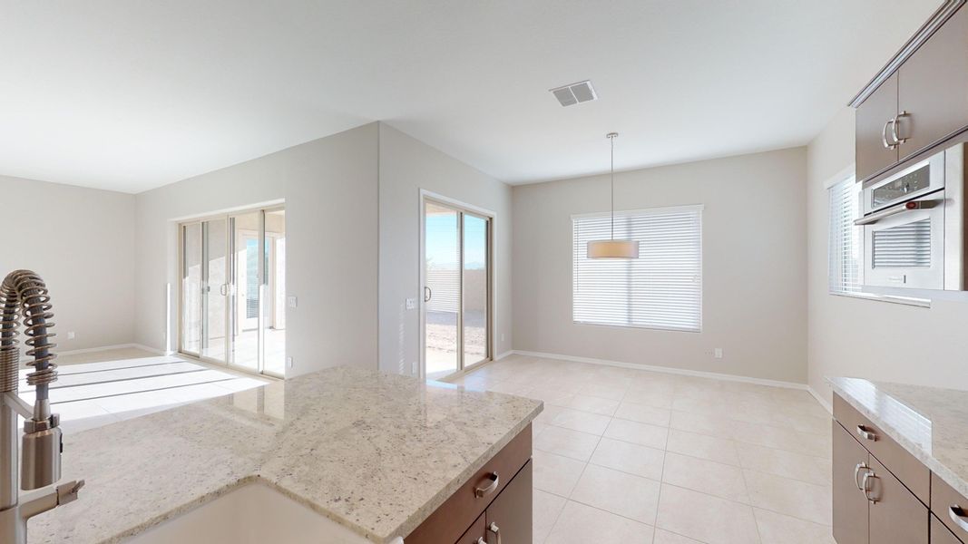 Representative furnished interior of a home built from the Benissa by DRB Homes in Windrose, Waddell (Image 7).