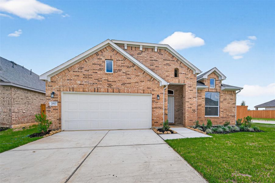 Front exterior of a new home in Cypress Green, Hockley, TX, highlighting curb appeal (Image 26).
