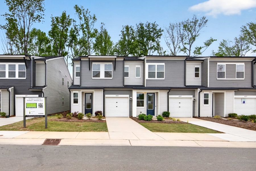 Front exterior of a new home in Fifteen 15 Cannon, Charlotte, NC, highlighting curb appeal (Image 2). Front exterior of a new home in Fifteen 15 Cannon, Charlotte, NC, highlighting curb appeal (Image 2).