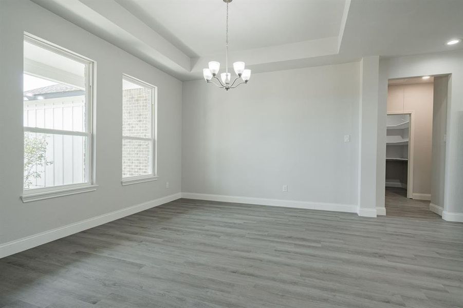 Spare room featuring light hardwood / wood-style floors and ceiling fan