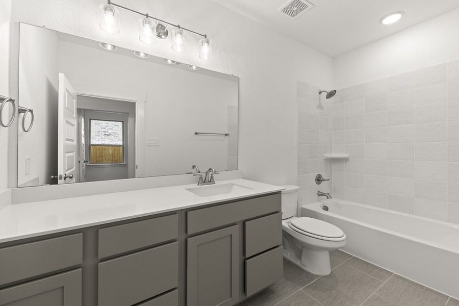 Representative furnished interior of a home built from the Olive III Harrington Trails Cornerstone I Series by Brohn Homes in Harrington Trails, New Caney (Image 11).