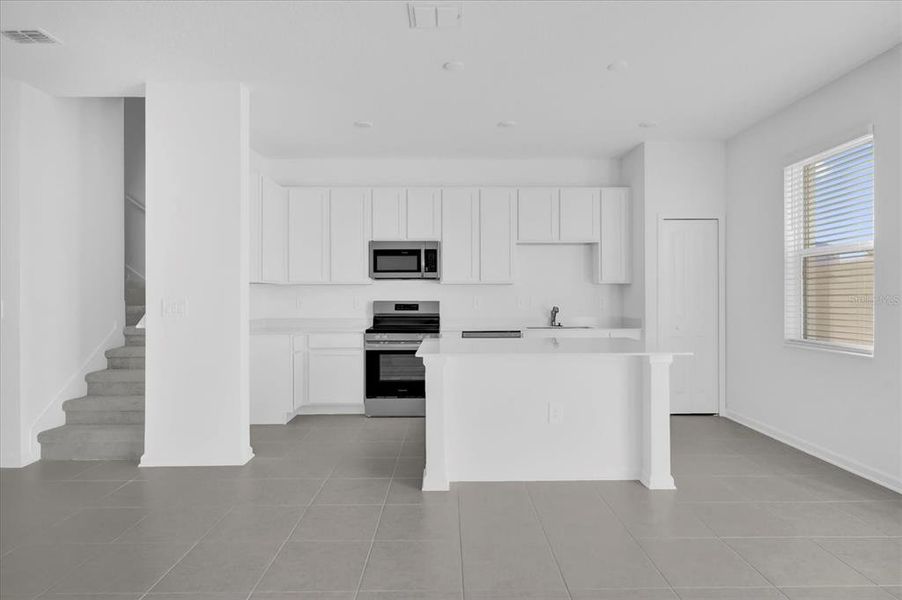 Furnished interior view inside a new home in , Kissimmee (Image 6).