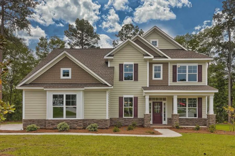Front exterior of a new home in Griffon Pointe, Lillington, NC, highlighting curb appeal (Image 1). Front exterior of a new home in Griffon Pointe, Lillington, NC, highlighting curb appeal (Image 1).