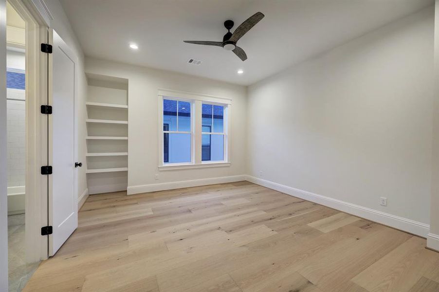 One of three secondary bedrooms upstairs