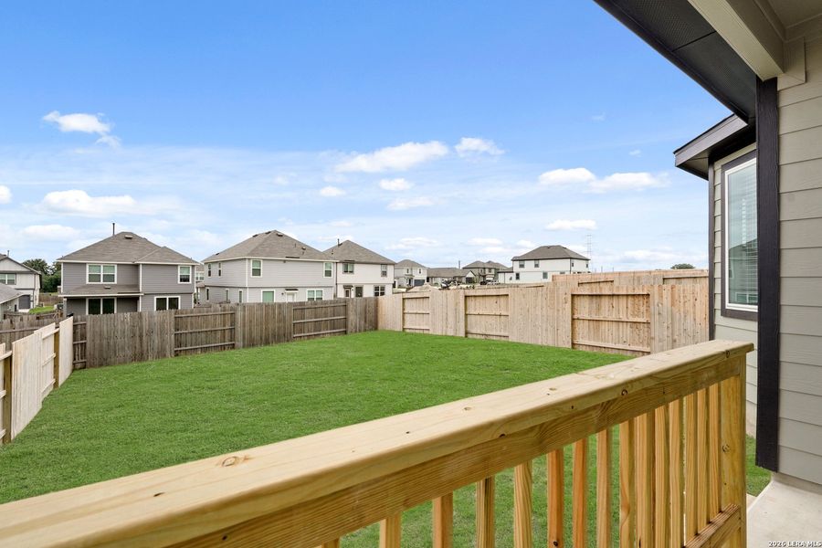 Exterior details and patio area of a home in Hickory Ridge, Elmendorf (Image 3).