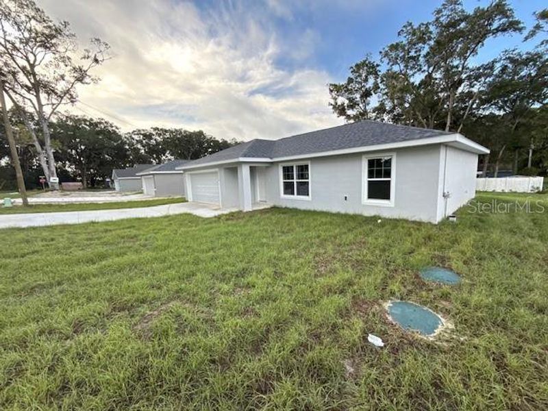 Front exterior of a new home in , Dunnellon, FL, highlighting curb appeal (Image 1). Front exterior of a new home in , Dunnellon, FL, highlighting curb appeal (Image 1).