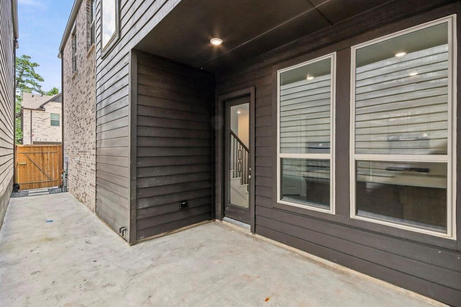 Exterior details and patio area of a home in Woodforest Townhomes, Montgomery (Image 2). Exterior details and patio area of a home in Woodforest Townhomes, Montgomery (Image 2).