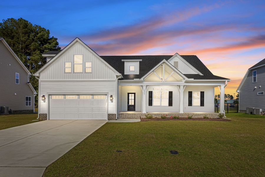 Front exterior of a new home in The Preserve at Langston, Winterville, NC, highlighting curb appeal (Image 2).