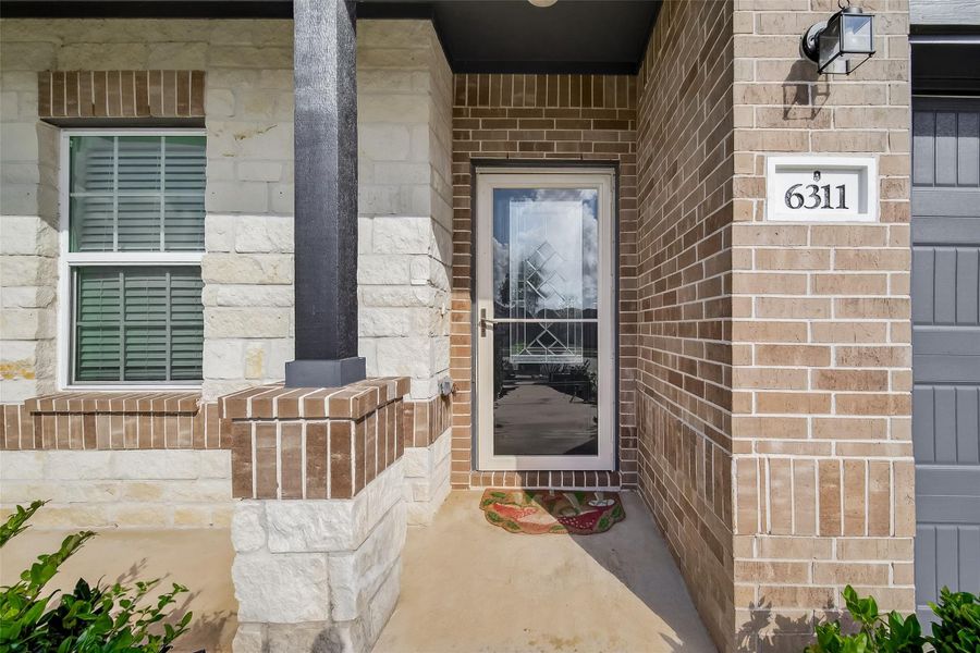 Exterior details and patio area of a home in Massey Oaks, Pearland (Image 3).