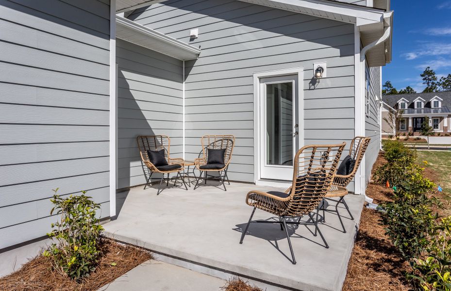 Porch behind the house. Model Home Representation.