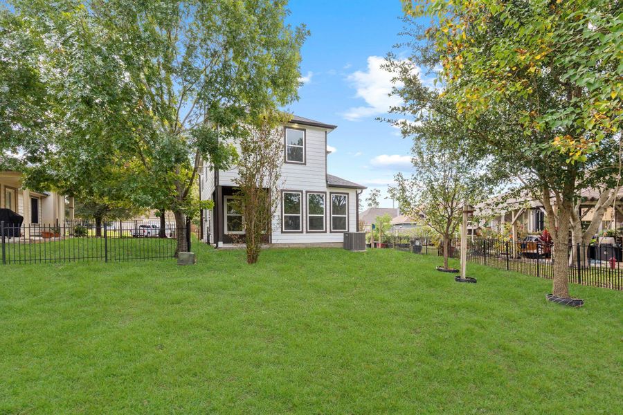 The spacious backyard provides room for play, gardening or simple afternoons spent outdoors. The mature trees add shade and character that make the space feel welcoming. The spacious backyard provides room for play, gardening or simple afternoons spent outdoors. The mature trees add shade and character that make the space feel welcoming.