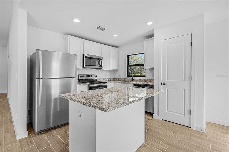 Furnished interior view inside a new home in Port Charlotte, North Port (Image 5).