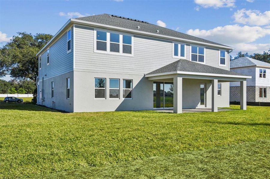 Exterior details and patio area of a home in Solace at Corner Lake, Orlando (Image 4). Exterior details and patio area of a home in Solace at Corner Lake, Orlando (Image 4).