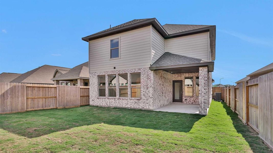 Front exterior of a new home in Candela South 40', Richmond, TX, highlighting curb appeal (Image 2). Front exterior of a new home in Candela South 40', Richmond, TX, highlighting curb appeal (Image 2).