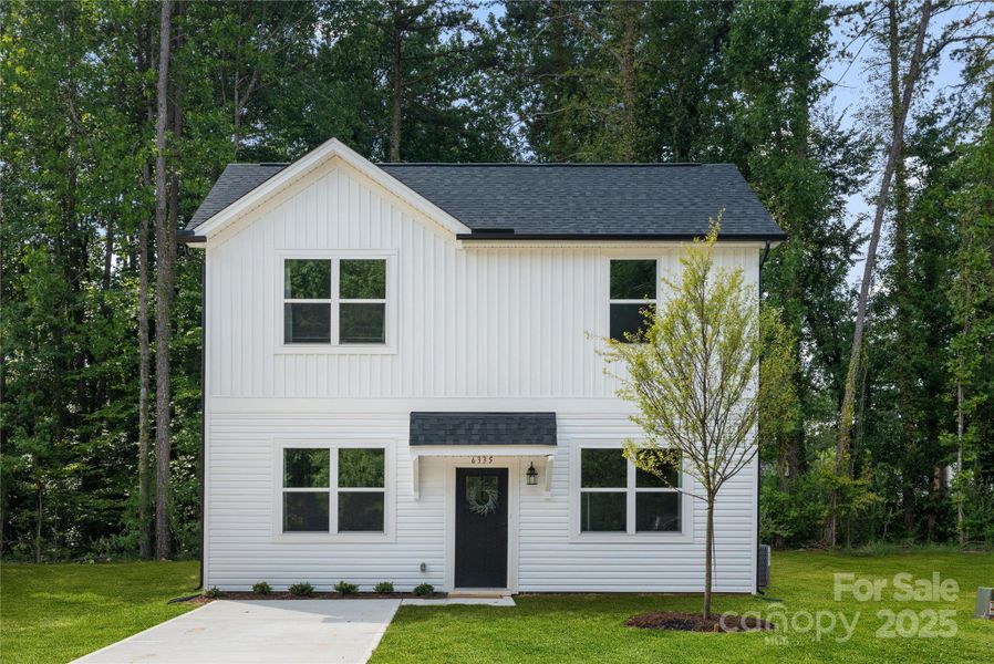 Front exterior of a new home in , Statesville, NC, highlighting curb appeal (Image 1). Front exterior of a new home in , Statesville, NC, highlighting curb appeal (Image 1).