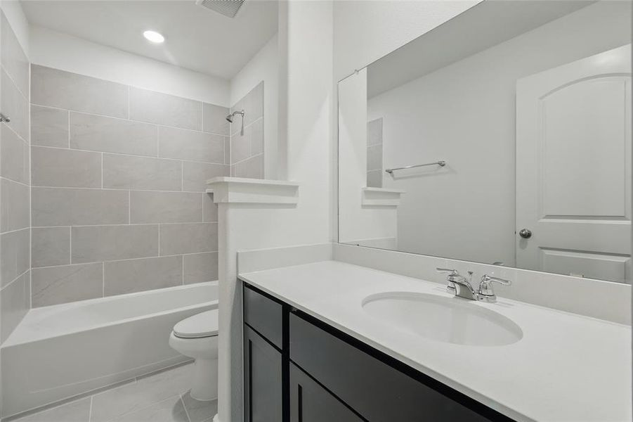 Bathroom with vanity and  shower combination