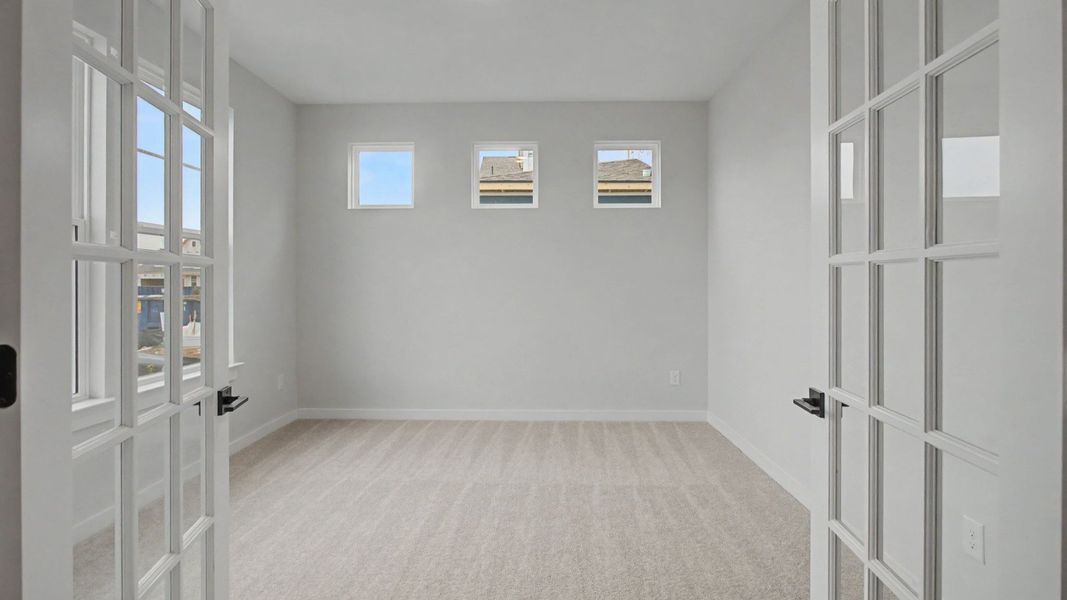 Dedicated study with glass insert French doors and bright windows