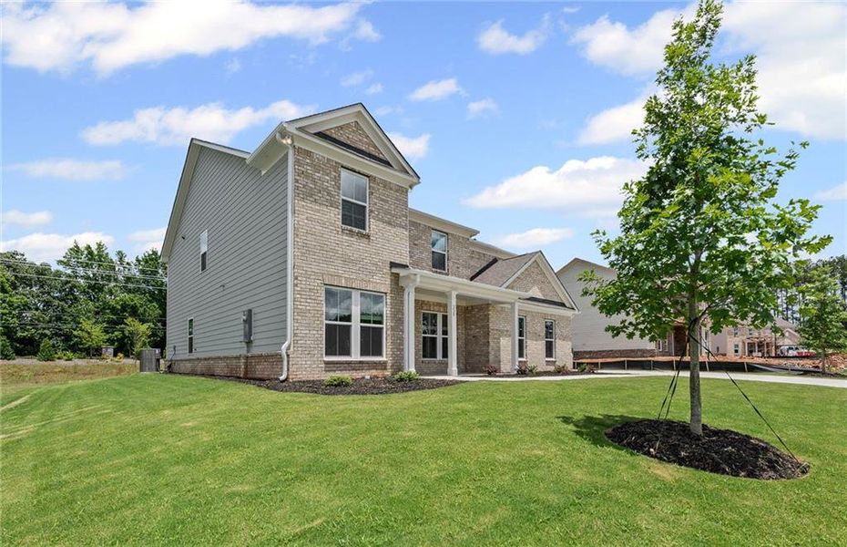 Front exterior of a new home in Anderson Point Estates, McDonough, GA, highlighting curb appeal (Image 21).