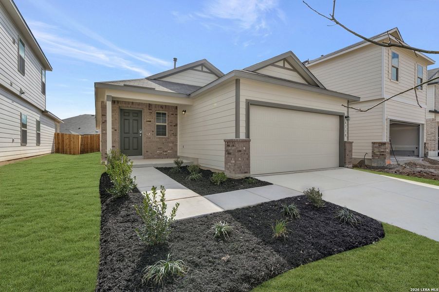 Front exterior of a new home in Winding Brook, San Antonio, TX, highlighting curb appeal (Image 26).