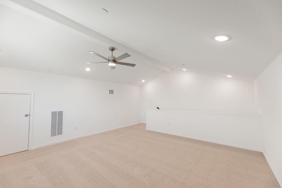 Unfurnished room featuring a ceiling fan, light carpet, beam ceiling, and recessed lighting