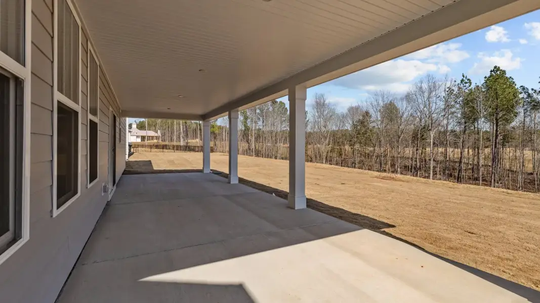 Norris Design expansive rear covered porch. At Lakeside Glen by premier builder DRB Homes in York, SC. Norris Design expansive rear covered porch. At Lakeside Glen by premier builder DRB Homes in York, SC.