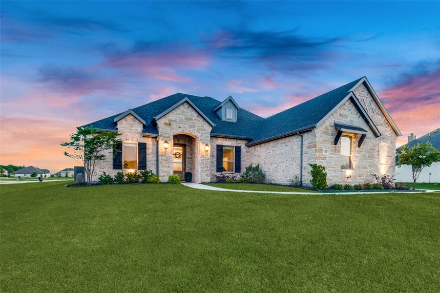 Front exterior of a new home in Lynx Hollow Estates, Forney, TX, highlighting curb appeal (Image 19).