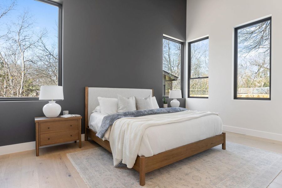 Bedroom featuring baseboards and light wood-style flooring