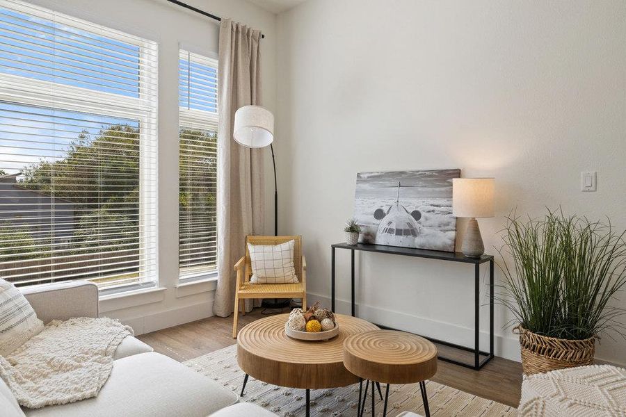 Living area featuring wood finished floors and baseboards