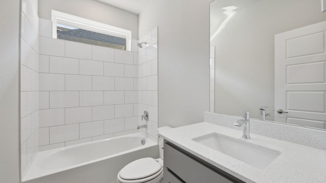 Representative furnished interior of a home built from the BASSWOOD by D.R. Horton in Treeline, Justin (Image 5).