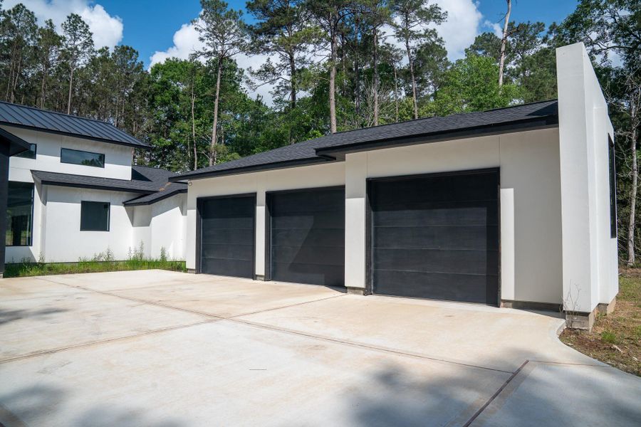 Front exterior of a new home in , Huntsville, TX, highlighting curb appeal (Image 19).