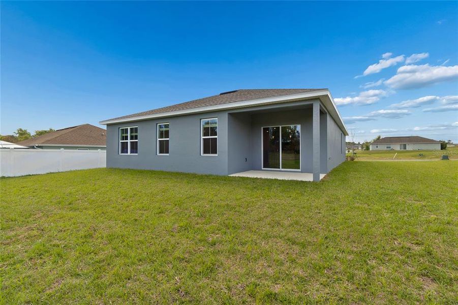 Exterior details and patio area of a home in Aspire at Glen Aire, Ocala (Image 17).