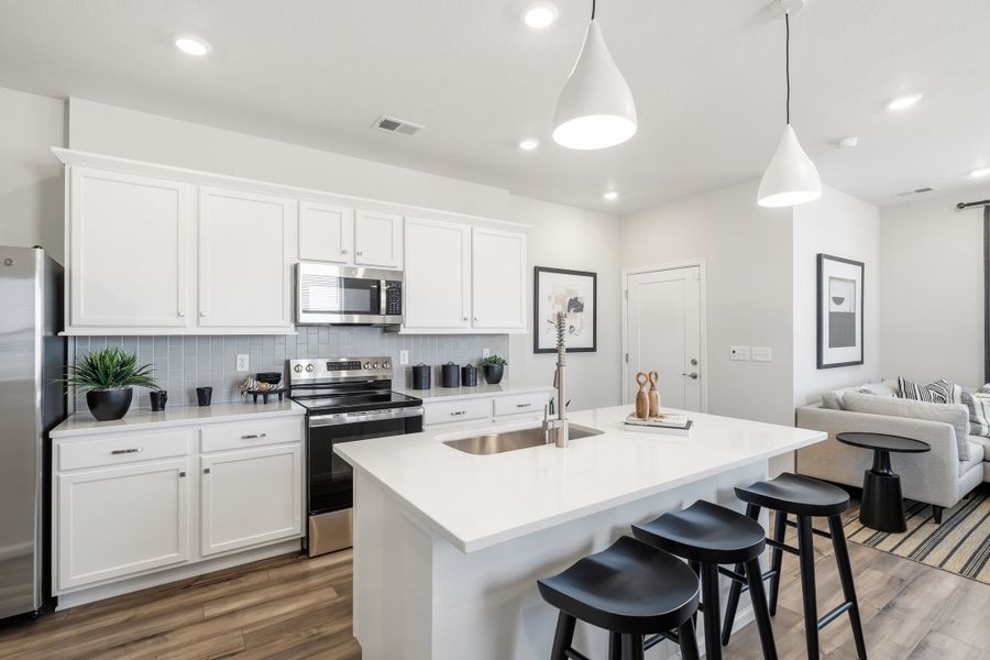 Representative furnished interior of a home built from the 2003 by Risewell Homes in Harvest Crossing, Aurora (Image 6).