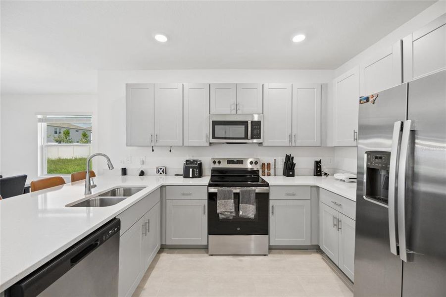 Furnished interior view inside a new home in Westview Community Group Page, Kissimmee (Image 9).