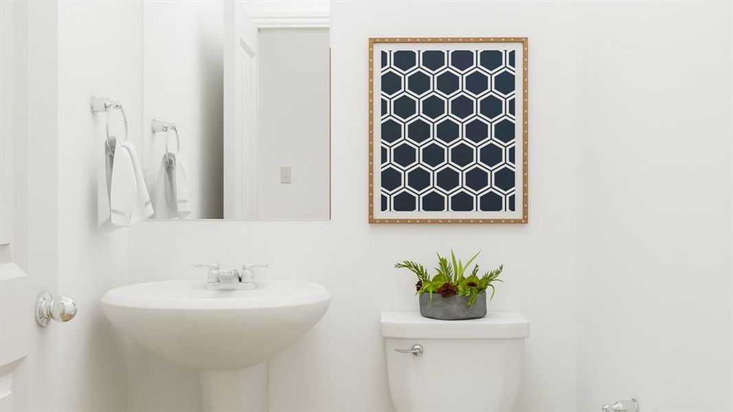 Bathroom featuring sink and toilet