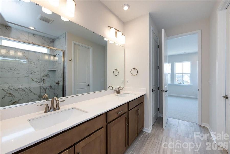 Warm Brown Cabinets and white Quartz Countertops