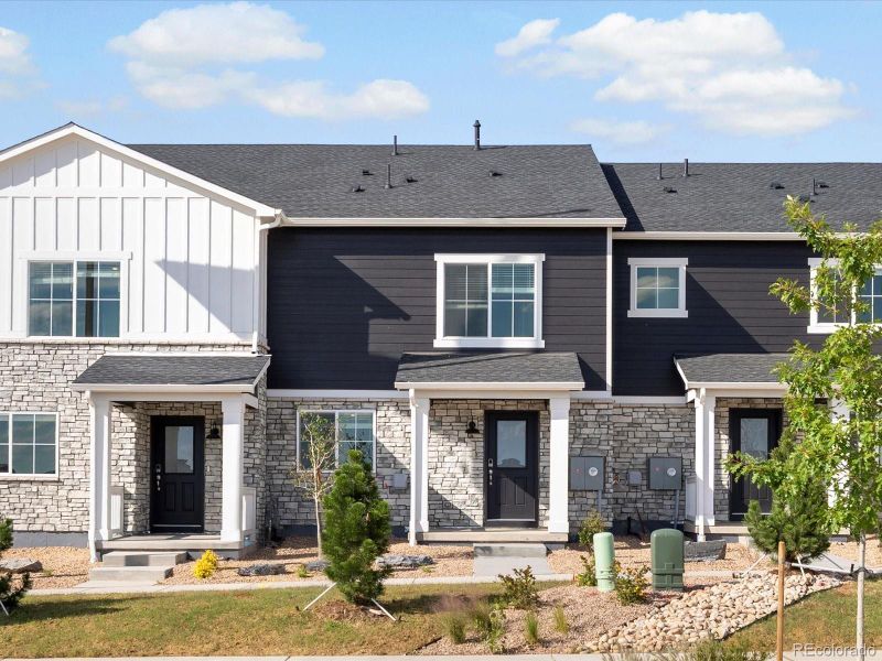 Front exterior of a new home in Skyview at High Point, Aurora, CO, highlighting curb appeal (Image 20).