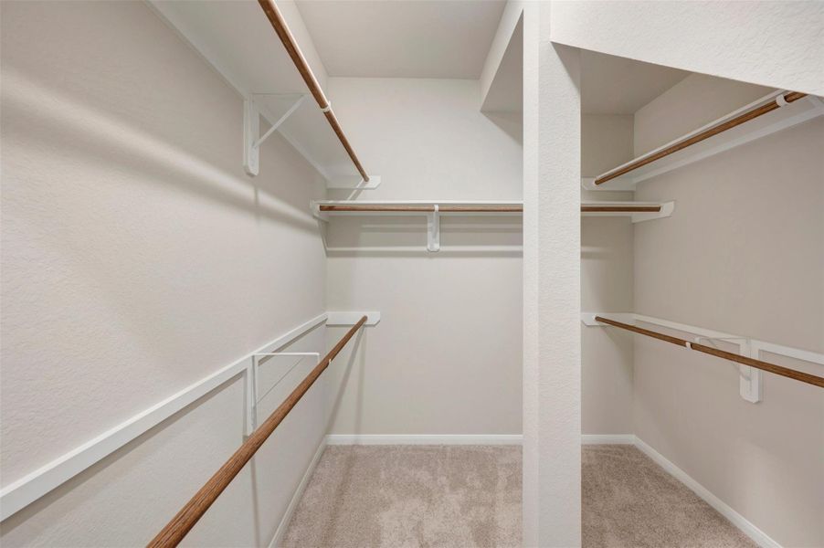 Walk-in closet in the owner's suite (*Photo not of actual home and used for illustration purposes only.)