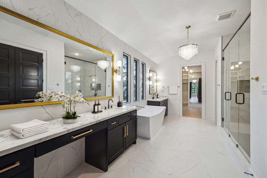 Primary bath features luxury finishes, double vanities, soaking tub and walk-in shower Primary bath features luxury finishes, double vanities, soaking tub and walk-in shower