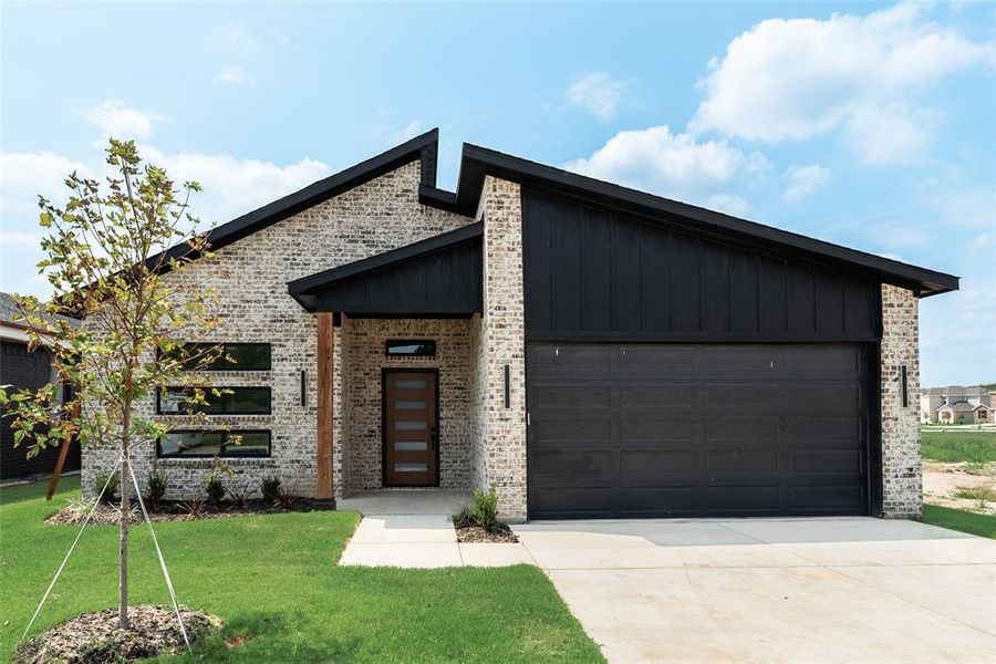 Front exterior of a new home in , Greenville, TX, highlighting curb appeal (Image 16). Front exterior of a new home in , Greenville, TX, highlighting curb appeal (Image 16).