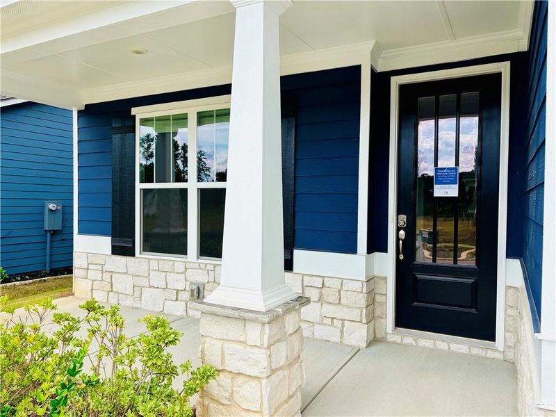 Exterior details and patio area of a home in Heritage Pointe at The Georgian, Villa Rica (Image 13).