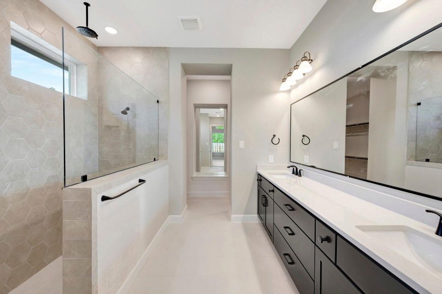 Relax at the end of a long day or start off your mornings in this Texas sized shower with 2 shower  heads!