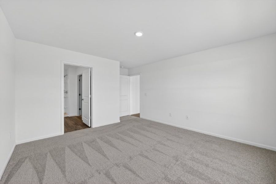 A hallway with white walls.