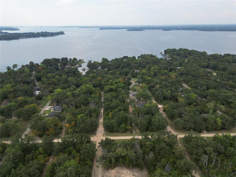 Drone / aerial view of a nearby body of water and a forest Drone / aerial view of a nearby body of water and a forest