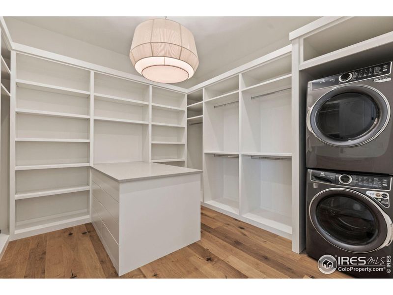 Primary closet with stackable laundry
