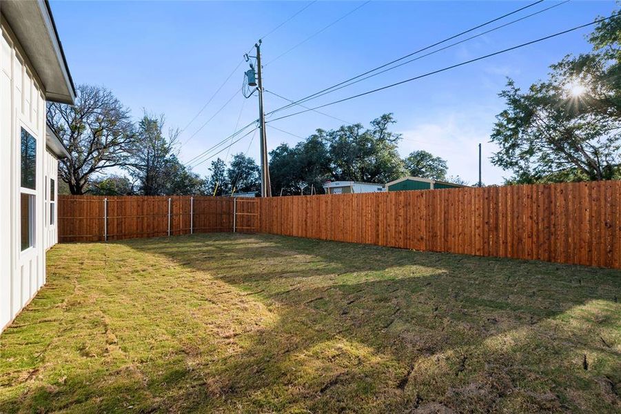 View of fenced backyard