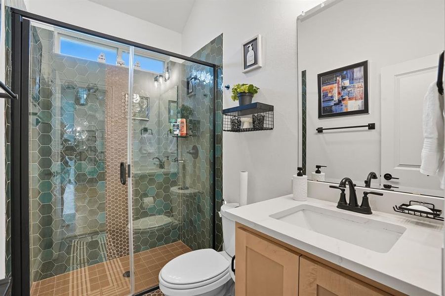 Full bathroom featuring vanity and a shower stall
